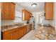 Updated kitchen featuring granite counters, stainless steel appliances, and wood cabinets at 117 Blue Bonnet St, Summerville, SC 29483