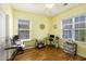 Bright home office with natural light from two windows, modern computer, and beautiful wood laminate floors at 117 Blue Bonnet St, Summerville, SC 29483