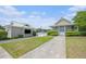 Community pool house and grassy area on a sunny day with blue sky and white clouds at 117 Blue Bonnet St, Summerville, SC 29483