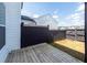 Backyard features a wooden deck, well-maintained fencing, and green space, ideal for outdoor entertaining and relaxation at 119 Summer Tanager Dr, Ravenel, SC 29470