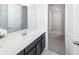 Stylish bathroom vanity with a modern sink, dark cabinets, and mirror, providing both functionality and aesthetic appeal at 119 Summer Tanager Dr, Ravenel, SC 29470
