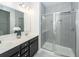 Bathroom featuring a dual sink vanity with a quartz countertop and tile shower at 119 Summer Tanager Dr, Ravenel, SC 29470