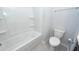 Clean bathroom featuring a shower-tub combo and toilet, with sleek fixtures, and easy-to-maintain surfaces at 119 Summer Tanager Dr, Ravenel, SC 29470