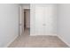 An inviting room featuring plush carpeting, neutral walls, and convenient access to a spacious closet, ensuring both comfort and functionality at 119 Summer Tanager Dr, Ravenel, SC 29470