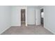 Carpeted bedroom with a door leading to the bathroom with a glass shower at 119 Summer Tanager Dr, Ravenel, SC 29470