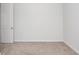 Bedroom featuring neutral carpet, fresh paint, and a door at 119 Summer Tanager Dr, Ravenel, SC 29470