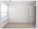 A well-lit room with neutral walls and plush carpeting, creating a serene and inviting space at 119 Summer Tanager Dr, Ravenel, SC 29470