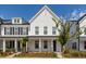 Inviting two-story home with a covered front porch and meticulously maintained landscaping at 119 Summer Tanager Dr, Ravenel, SC 29470