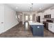 A kitchen island with a white countertop and a deep blue base featuring stainless steel appliances at 119 Summer Tanager Dr, Ravenel, SC 29470