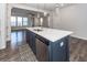Kitchen island featuring a stainless steel dishwasher, sink, and white countertop at 119 Summer Tanager Dr, Ravenel, SC 29470