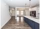 Open kitchen featuring a spacious island with white countertops and stainless steel appliances at 119 Summer Tanager Dr, Ravenel, SC 29470