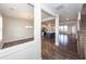 Open-concept living spaces showcasing hardwood floors, with a dining area, kitchen and stairs at 119 Summer Tanager Dr, Ravenel, SC 29470