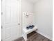 Cozy mud room with built-in bench, coat hooks, and convenient storage solutions at 119 Summer Tanager Dr, Ravenel, SC 29470