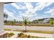 Picturesque street view showcasing charming homes and well-manicured landscaping at 119 Summer Tanager Dr, Ravenel, SC 29470