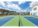 Enjoy the community's tennis and pickleball courts, set against a backdrop of beautiful homes and lush trees at 119 Summer Tanager Dr, Ravenel, SC 29470