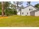 Expansive backyard showcasing a newly constructed home surrounded by mature trees at 120 Mcmakin Dr # 16, Summerville, SC 29483