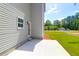 Exterior view of a home with a backyard featuring lush green grass at 120 Mcmakin Dr # 16, Summerville, SC 29483