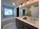 Well-lit bathroom features double sinks, a soaking tub, a separate shower, and modern fixtures at 120 Mcmakin Dr # 16, Summerville, SC 29483
