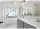 Modern bathroom with double sinks, large mirror, and separate tub and shower at 120 Mcmakin Dr # 16, Summerville, SC 29483