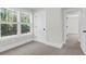 Bright bedroom with large windows, white trim, and neutral carpeting at 120 Mcmakin Dr # 16, Summerville, SC 29483