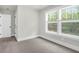Sunlit bedroom with large windows and neutral color scheme at 120 Mcmakin Dr # 16, Summerville, SC 29483