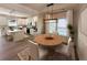 Bright dining room with a round table, seating for six, and natural light from the window at 120 Mcmakin Dr # 16, Summerville, SC 29483