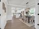 Bright dining room featuring a wooden table, beige chairs, and an open layout leading into the kitchen area at 120 Mcmakin Dr # 16, Summerville, SC 29483