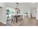 Cozy dining area with a wooden table, surrounded by windows, and a clear view of the outdoor greenery at 120 Mcmakin Dr # 16, Summerville, SC 29483