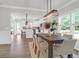 Charming dining room with an open layout, featuring a wooden table, and views of the kitchen and backyard at 120 Mcmakin Dr # 16, Summerville, SC 29483