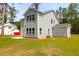 Backyard of a two-story home featuring large windows, offering natural light throughout at 120 Mcmakin Dr # 16, Summerville, SC 29483