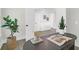 Detailed view of a home office with plants, a book, and pencils on a modern-style black desk at 120 Mcmakin Dr # 16, Summerville, SC 29483