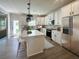 Modern kitchen features white cabinets, stainless steel appliances, a center island, and wood floors at 120 Mcmakin Dr # 16, Summerville, SC 29483