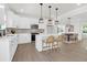 Bright, modern kitchen with white cabinetry, stainless steel appliances, and an island with barstool seating at 120 Mcmakin Dr # 16, Summerville, SC 29483