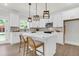 Modern kitchen with white cabinets, a marble countertop island, and trendy pendant lighting at 120 Mcmakin Dr # 16, Summerville, SC 29483