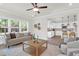 Bright, open living room featuring modern decor, hardwood floors, and an adjacent kitchen area at 120 Mcmakin Dr # 16, Summerville, SC 29483