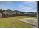Large backyard with green grass, a concrete patio and a sturdy wooden fence at 124 Sumac Dr, Goose Creek, SC 29445