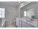 Bathroom with double sink vanity, toilet, and tub with tile backsplash at 124 Sumac Dr, Goose Creek, SC 29445