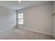 Well-lit bedroom featuring neutral carpet and a window at 124 Sumac Dr, Goose Creek, SC 29445
