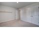 Bright bedroom with doors, neutral carpet, and adjacent space at 124 Sumac Dr, Goose Creek, SC 29445