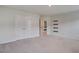 Bedroom featuring neutral carpet, doors, and shelving at 124 Sumac Dr, Goose Creek, SC 29445