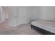 Bedroom featuring neutral carpet, doors, and an adjacent space at 124 Sumac Dr, Goose Creek, SC 29445