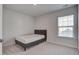 Bright bedroom with neutral carpet, headboard, and natural light from a window at 124 Sumac Dr, Goose Creek, SC 29445
