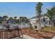 Community pool with palm trees, lounge chairs, and a lending library within walking distance at 124 Sumac Dr, Goose Creek, SC 29445
