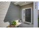 Inviting front door with sidelights and a small garden area at 124 Sumac Dr, Goose Creek, SC 29445