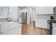 Bright kitchen featuring stainless steel appliances and white cabinets at 124 Sumac Dr, Goose Creek, SC 29445