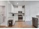 Well-appointed kitchen with stainless steel appliances and a view into the laundry room at 124 Sumac Dr, Goose Creek, SC 29445