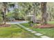 Secluded backyard featuring a sparkling pool, a cozy pavilion, and lush greenery for ultimate relaxation at 126 Sparrow Dr, Isle of Palms, SC 29451