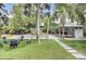 Picturesque backyard featuring a pool, fire pit seating, and a stylish cabana at 126 Sparrow Dr, Isle of Palms, SC 29451