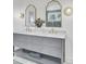 Bathroom with double sink vanity, framed mirrors and marble countertop at 126 Sparrow Dr, Isle of Palms, SC 29451