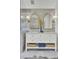 Bathroom featuring double vanity with decorative gold trimmed mirrors at 126 Sparrow Dr, Isle of Palms, SC 29451